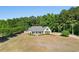 Aerial view of the home showcasing the large front lawn and surrounding trees at 1676 Elder Ln., Galivants Ferry, SC 29544