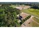Birds-eye view of the property with a fire pit, and an outbuilding near a forested area at 1676 Elder Ln., Galivants Ferry, SC 29544