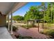 View of a charming back patio with a pergola and open backyard space at 1676 Elder Ln., Galivants Ferry, SC 29544