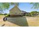 Spacious backyard featuring a pergola, black fence, and lush greenery, ideal for outdoor entertaining and relaxation at 1676 Elder Ln., Galivants Ferry, SC 29544