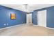 Bedroom with blue walls, carpet flooring, and a ceiling fan at 1676 Elder Ln., Galivants Ferry, SC 29544
