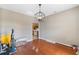 Bare dining room featuring hard wood flooring, hanging light, and arched doorway, waiting for personalization at 1676 Elder Ln., Galivants Ferry, SC 29544