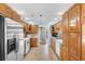 Functional kitchen with stainless steel refrigerator, wood cabinets, and white appliances, ample storage and workspace at 1676 Elder Ln., Galivants Ferry, SC 29544