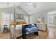 Bright main bedroom with vaulted ceiling, four poster bed and ensuite bath at 1676 Elder Ln., Galivants Ferry, SC 29544