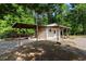 View of an outbuilding with covered parking, perfect for boat storage at 1676 Elder Ln., Galivants Ferry, SC 29544