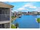 Screened balcony overlooks lush lawns, community waterways, and nearby beachfront condos at 1900 Duffy St. # A8, North Myrtle Beach, SC 29582