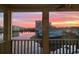 Sunset view from the screened-in porch overlooking the community and reflecting lake at 1900 Duffy St. # A8, North Myrtle Beach, SC 29582