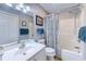 Bright bathroom features a shower/tub combo with vanity with great lighting at 1900 Duffy St. # A8, North Myrtle Beach, SC 29582