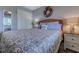 Bright bedroom featuring a comfortable queen bed, soft lighting, and closet at 1900 Duffy St. # A8, North Myrtle Beach, SC 29582