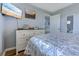 Bedroom showcases a comfortable queen bed, dresser, and mounted television at 1900 Duffy St. # A8, North Myrtle Beach, SC 29582