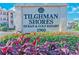 A community sign surrounded by beautiful landscaping welcomes you to Tilghman Shores at 1900 Duffy St. # A8, North Myrtle Beach, SC 29582