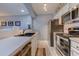 Contemporary kitchen with stainless steel appliances, white cabinets, and ample counter space at 1900 Duffy St. # A8, North Myrtle Beach, SC 29582
