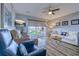 Cozy living room with wood floors, comfortable seating and a sliding glass door to the balcony at 1900 Duffy St. # A8, North Myrtle Beach, SC 29582