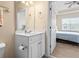 Bright bathroom with a single sink vanity and an open doorway to the bedroom at 200 Castle Dr. # 1369, Myrtle Beach, SC 29579