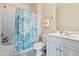 Cozy bathroom features tub-shower combo and a white single sink vanity at 200 Castle Dr. # 1369, Myrtle Beach, SC 29579