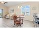 Dining and living areas feature modern lighting, wood floors, and slider access to an outdoor balcony at 200 Castle Dr. # 1369, Myrtle Beach, SC 29579