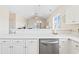 Modern kitchen with a stainless steel dishwasher and a view into the open-concept living space at 200 Castle Dr. # 1369, Myrtle Beach, SC 29579