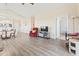 Bright, open living room with wood floors, comfortable furniture, and easy access to kitchen and dining area at 200 Castle Dr. # 1369, Myrtle Beach, SC 29579