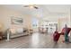 Inviting living room with hardwood floors, ceiling fan, and access to the kitchen and dining area at 200 Castle Dr. # 1369, Myrtle Beach, SC 29579