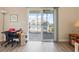 Desk and an outdoor patio visible through the sliding glass doors at 200 Castle Dr. # 1369, Myrtle Beach, SC 29579