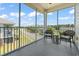 Enjoy community views from this screened-in porch with wicker seating at 200 Castle Dr. # 1369, Myrtle Beach, SC 29579