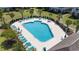 Refreshing outdoor swimming pool surrounded by lounge chairs and palm trees at 200 Castle Dr. # 1369, Myrtle Beach, SC 29579