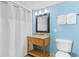 Cozy bathroom with a granite vanity, framed mirror, and a shower with a curtain at 2000 N Ocean Blvd. # 301, Myrtle Beach, SC 29577