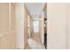 Image of hallway with beige walls and white trim leading to multiple rooms at 2000 N Ocean Blvd. # 301, Myrtle Beach, SC 29577