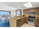Kitchen and dining area with ocean views and stainless steel appliances at 2000 N Ocean Blvd. # 301, Myrtle Beach, SC 29577
