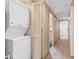 Image of laundry room with white appliances and storage closet at 2000 N Ocean Blvd. # 301, Myrtle Beach, SC 29577