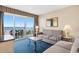 Comfortable living room with plush sofas and balcony access with ocean view, perfect for relaxation at 2000 N Ocean Blvd. # 301, Myrtle Beach, SC 29577