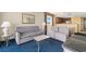 Open-concept living room with sofas, dining area and kitchen offers plenty of room for Gathering and guests at 2000 N Ocean Blvd. # 301, Myrtle Beach, SC 29577