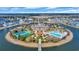 Aerial view of island clubhouse with pool, tennis courts, cabana, and water access at 2004 Crow Field Ct., Myrtle Beach, SC 29579
