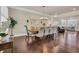 Elegant dining room with hardwood floors, decorative mirror, and a view of the living area at 2004 Crow Field Ct., Myrtle Beach, SC 29579