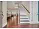Bright foyer with hardwood flooring, staircase, and a view of the living and dining area at 2004 Crow Field Ct., Myrtle Beach, SC 29579