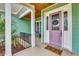 Welcoming front porch featuring wood ceilings, painted door, and a cozy space for relaxation at 2004 Crow Field Ct., Myrtle Beach, SC 29579