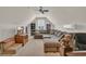 Large living room features a large sectional couch, television, and a ceiling fan at 2004 Crow Field Ct., Myrtle Beach, SC 29579