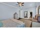 Bright main bedroom featuring a ceiling fan, hardwood floors, and ensuite access at 2004 Crow Field Ct., Myrtle Beach, SC 29579