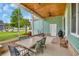 Charming screened porch has an outdoor dining area and an outdoor fireplace at 2004 Crow Field Ct., Myrtle Beach, SC 29579