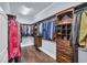 Spacious walk-in closet with custom wood shelving and clothing racks for optimal storage at 2004 Crow Field Ct., Myrtle Beach, SC 29579