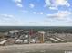 Panoramic aerial view of a coastal community bordering the ocean, complete with lush landscapes and a sandy beach at 204 Maison Dr. # N304, Myrtle Beach, SC 29572