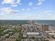 An aerial view showcases a coastal community, highlighting its proximity to the beach, lush greenery, and high-rise buildings at 204 Maison Dr. # N304, Myrtle Beach, SC 29572