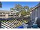 Balcony seating overlooking lush landscaping and a community pool at 204 Maison Dr. # N304, Myrtle Beach, SC 29572
