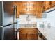 Functional kitchen showcases granite countertops and ample wooden cabinet space at 204 Maison Dr. # N304, Myrtle Beach, SC 29572