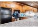 Charming kitchen features granite countertops, stainless steel appliances, and wood cabinetry at 204 Maison Dr. # N304, Myrtle Beach, SC 29572