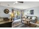 Cozy living room with a comfortable couch and a view of the outdoor balcony at 204 Maison Dr. # N304, Myrtle Beach, SC 29572
