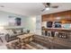 Comfortable living room with a ceiling fan, a view of the kitchen, and beach-themed art at 204 Maison Dr. # N304, Myrtle Beach, SC 29572
