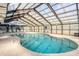 Indoor swimming pool with a clear glass roof and metal beams allowing natural light to fill the room at 204 Maison Dr. # N304, Myrtle Beach, SC 29572