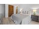Comfortable bedroom with stylish decor, side tables, and closet storage at 206 Maison Dr. # Q-204, Myrtle Beach, SC 29572
