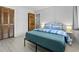 Well-lit bedroom with minimalist frame bed, bedside tables, and closet at 206 Maison Dr. # Q-204, Myrtle Beach, SC 29572